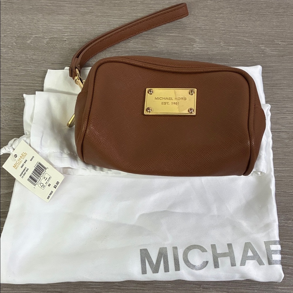 Bundle of Michael Kors light brown Wristlet and dust bag.